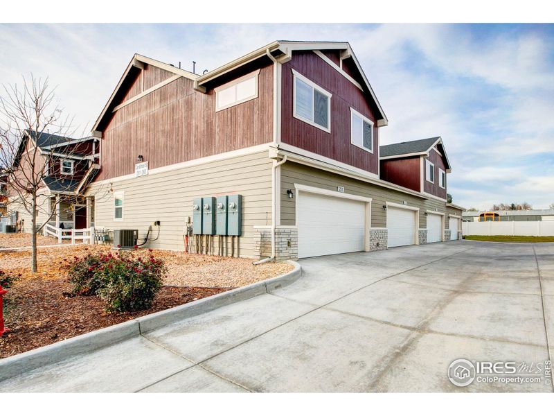 Front exterior of a new home in , Johnstown, CO, highlighting curb appeal (Image 1).