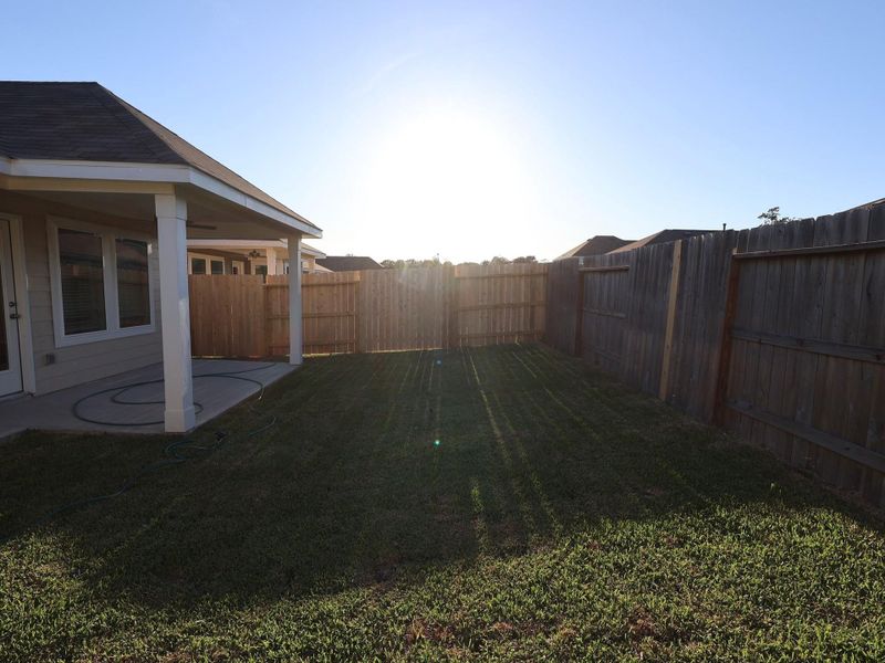Exterior details and patio area of a home in Pinewood at Grand Texas, New Caney (Image 3).