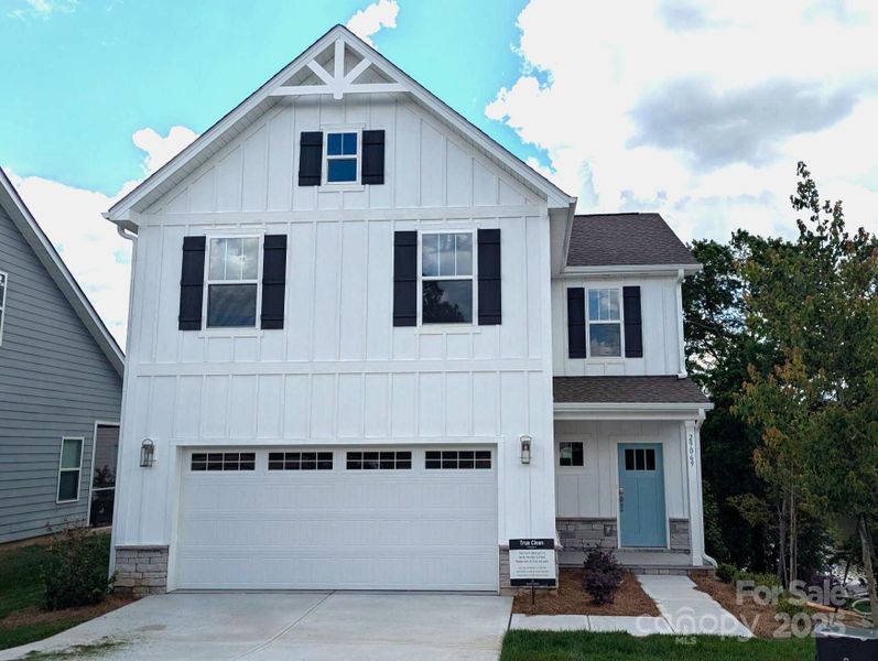 Front exterior of a new home in Edgewater - The Cottages, Lancaster, SC, highlighting curb appeal (Image 2). Front exterior of a new home in Edgewater - The Cottages, Lancaster, SC, highlighting curb appeal (Image 2).