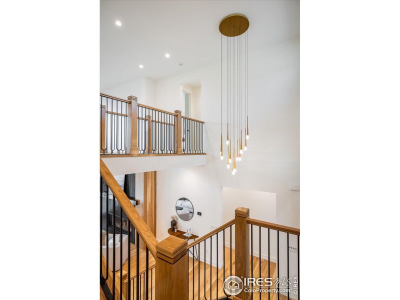 When your guests enter through the gorgeous custom front door and look up, they'll be stunned by this unique lighting that is truly perfect for the space.