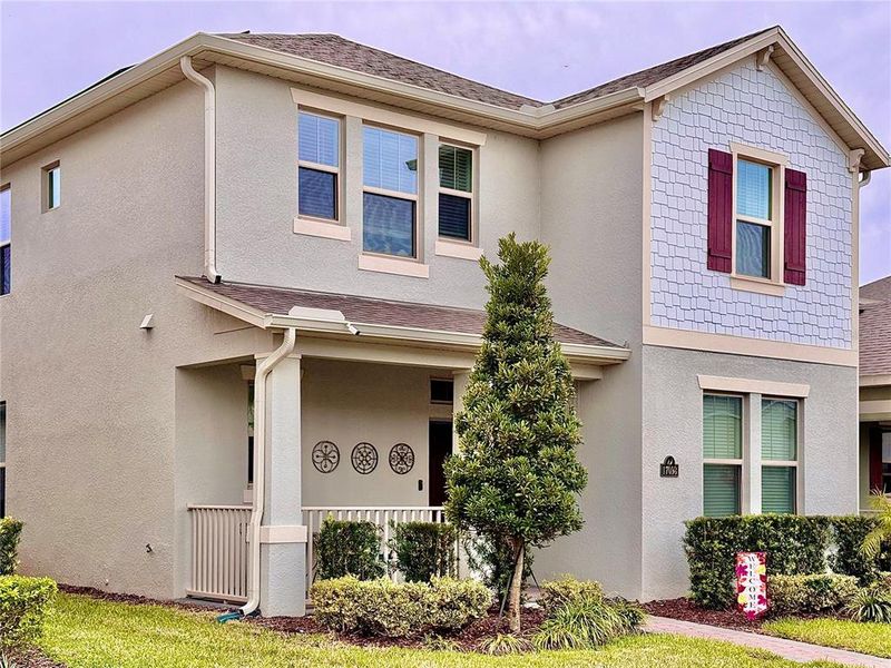 Front exterior of a new home in Waterleigh, Winter Garden, FL, highlighting curb appeal (Image 22). Front exterior of a new home in Waterleigh, Winter Garden, FL, highlighting curb appeal (Image 22).