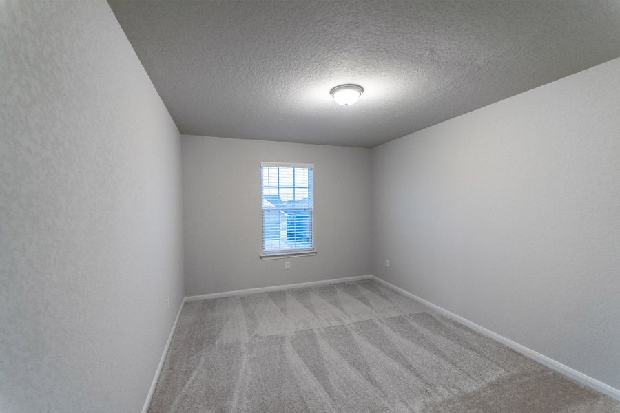 Spacious, unfurnished interior of a new home in Hennersby Hollow, San Antonio (Image 20).