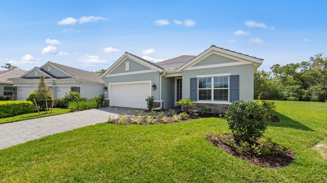 Front exterior of a new home in Verandah Real Estate and Homes for Sale in Fort Myers, FL - Neal Communities, Fort Myers, FL, highlighting curb appeal (Image 26). Front exterior of a new home in Verandah Real Estate and Homes for Sale in Fort Myers, FL - Neal Communities, Fort Myers, FL, highlighting curb appeal (Image 26).