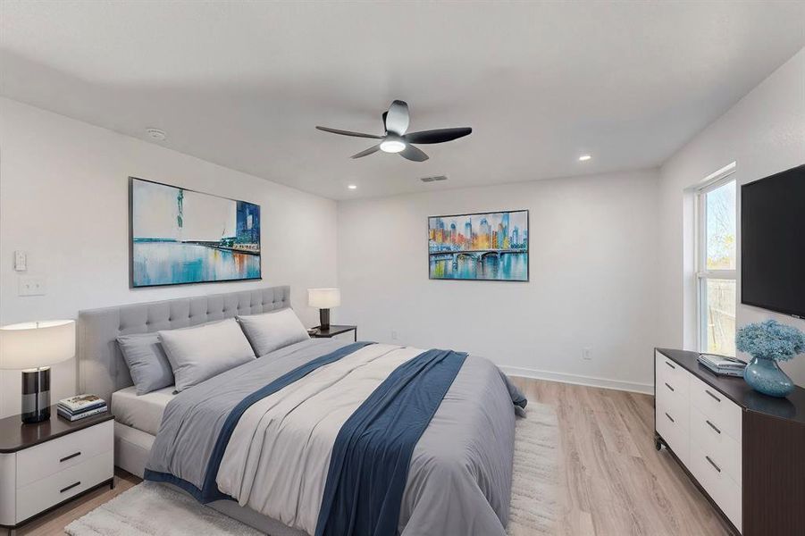 Bedroom with ceiling fan and light wood-type flooring