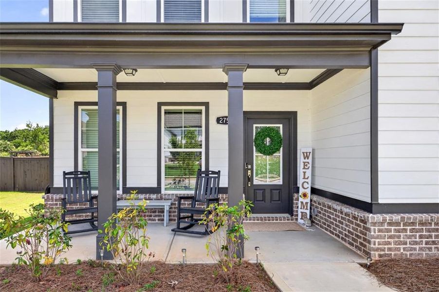Exterior details and patio area of a home in Porches at Mobley Lake, Dacula (Image 22).