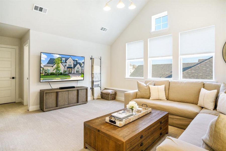 Comfortable Second Living Area - Upstairs flex space with plush carpet and vaulted ceilings—ideal for movie nights, game days, or simply relaxing in peace and quiet. Comfortable Second Living Area - Upstairs flex space with plush carpet and vaulted ceilings—ideal for movie nights, game days, or simply relaxing in peace and quiet.