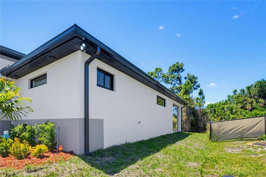 Exterior details and patio area of a home in , North Port (Image 31).