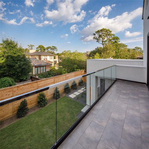 Enjoy a morning coffee on this Primary bedroom private terrace with back yard views