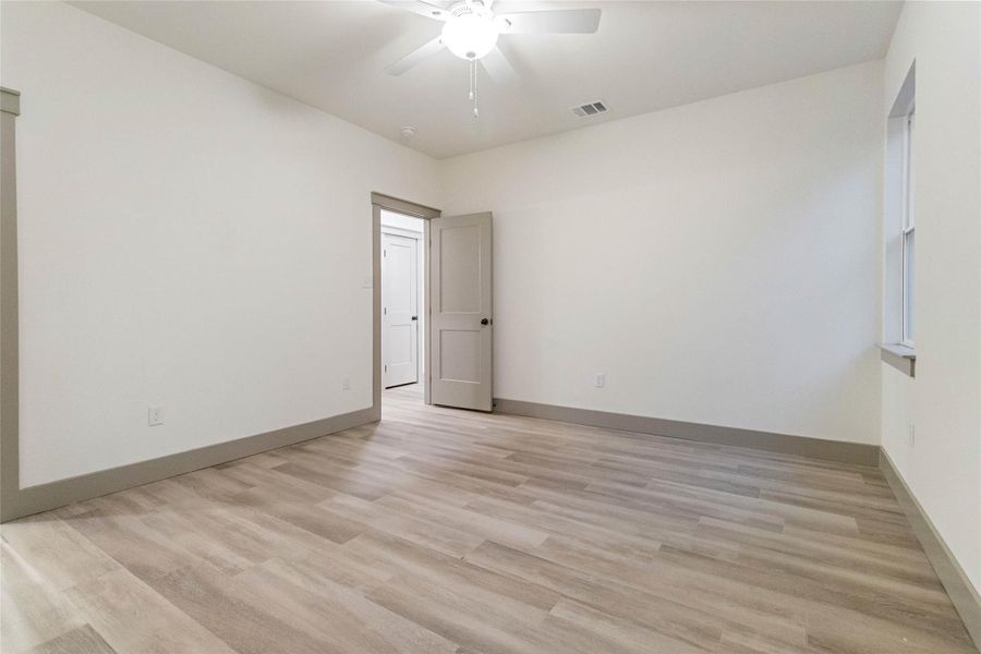 Primary bedroom with tile flooring