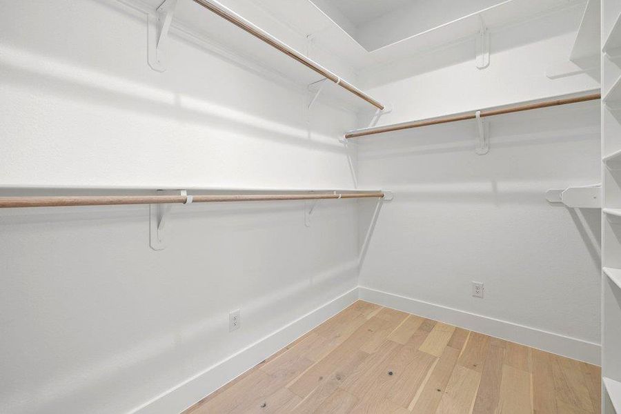 Walk in closet featuring light wood-style flooring