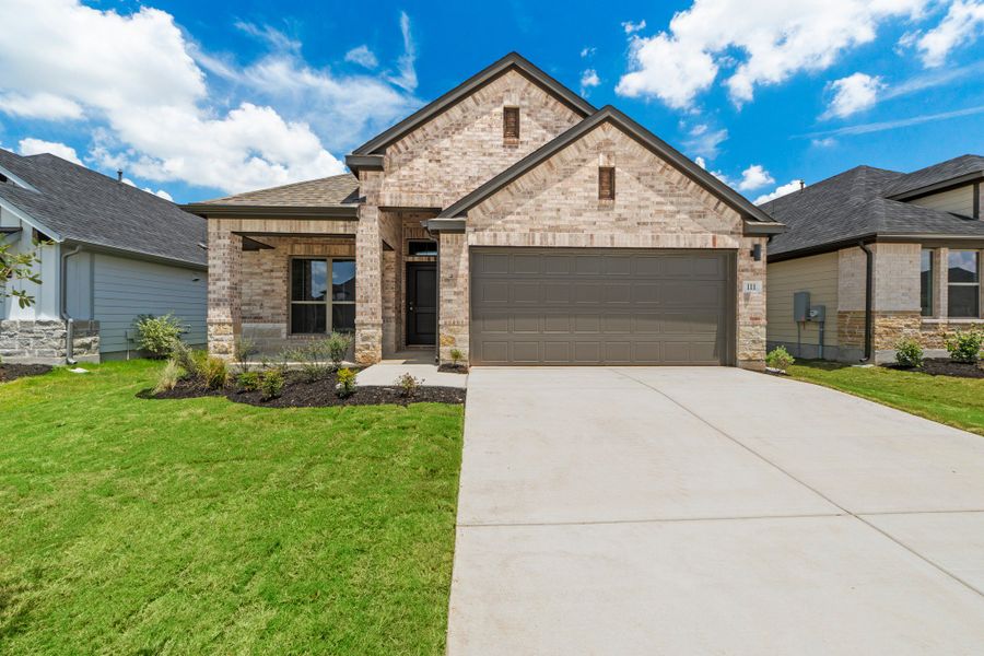 Front exterior of a new home in Prairie Winds, Hutto, TX, highlighting curb appeal (Image 1). Front exterior of a new home in Prairie Winds, Hutto, TX, highlighting curb appeal (Image 1).