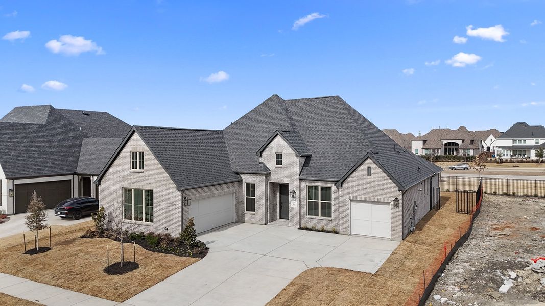 Front exterior of a new home in Quail Hollow, Rockwall, TX, highlighting curb appeal (Image 27). Front exterior of a new home in Quail Hollow, Rockwall, TX, highlighting curb appeal (Image 27).