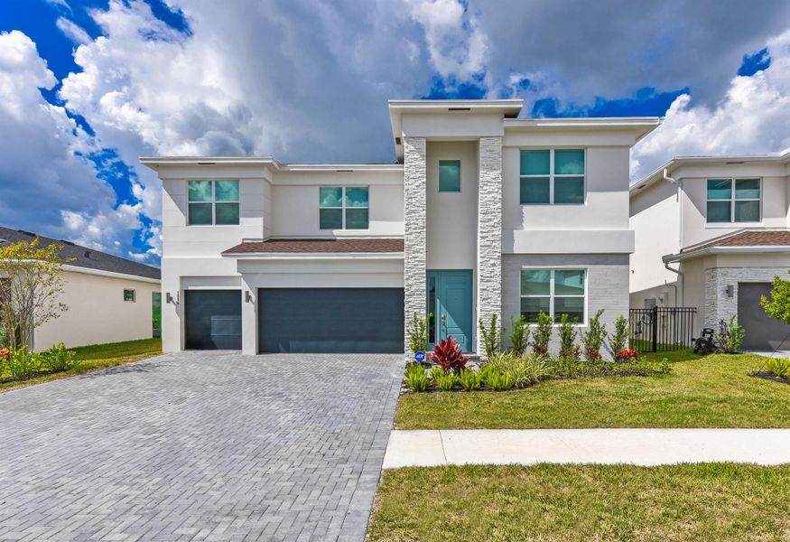 Front exterior of a new home in , Loxahatchee, FL, highlighting curb appeal (Image 1). Front exterior of a new home in , Loxahatchee, FL, highlighting curb appeal (Image 1).