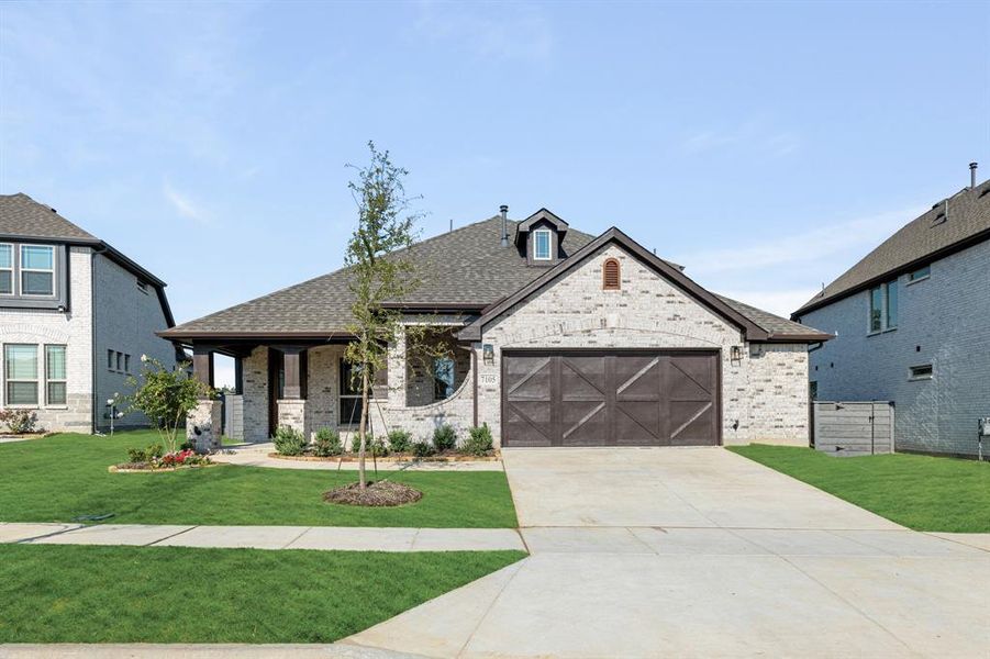 Front exterior of a new home in Union Park Classic 60, Little Elm, TX, highlighting curb appeal (Image 24). Front exterior of a new home in Union Park Classic 60, Little Elm, TX, highlighting curb appeal (Image 24).