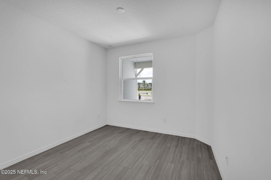 Spacious, unfurnished interior of a new home in Del Webb Wildlight, Yulee (Image 23).