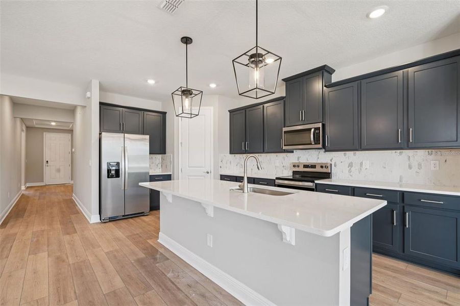 Furnished interior view inside a new home in Legends Preserve - Signature Series, Daytona Beach (Image 5). Furnished interior view inside a new home in Legends Preserve - Signature Series, Daytona Beach (Image 5).