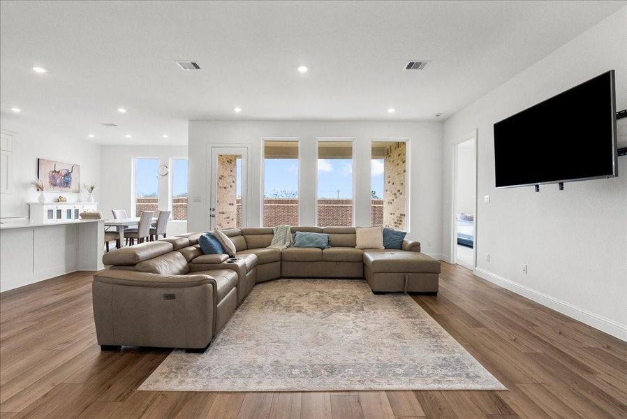 Spacious living room open to the kitchen for easy everyday living and gatherings. Spacious living room open to the kitchen for easy everyday living and gatherings.