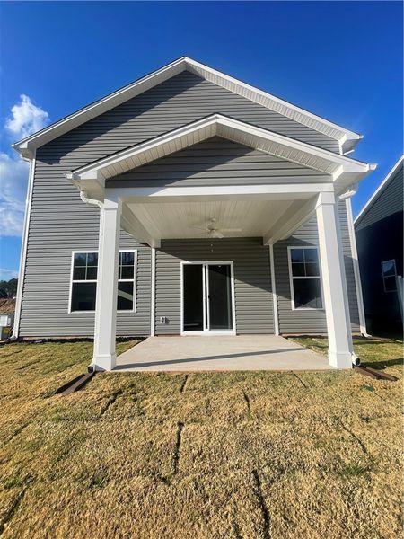 Exterior details and patio area of a home in Springwood Grove, Central (Image 3).