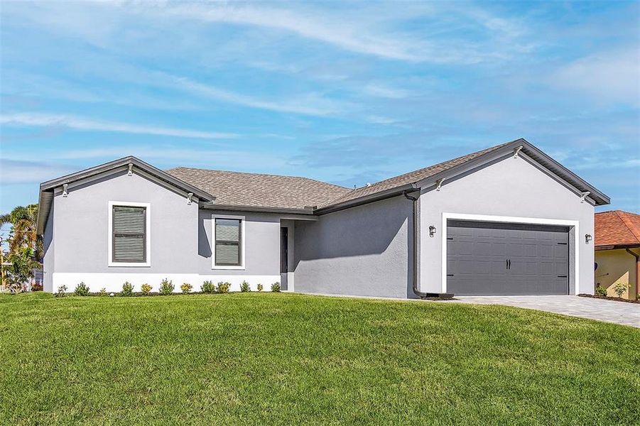 Front exterior of a new home in , Port Charlotte, FL, highlighting curb appeal (Image 1).