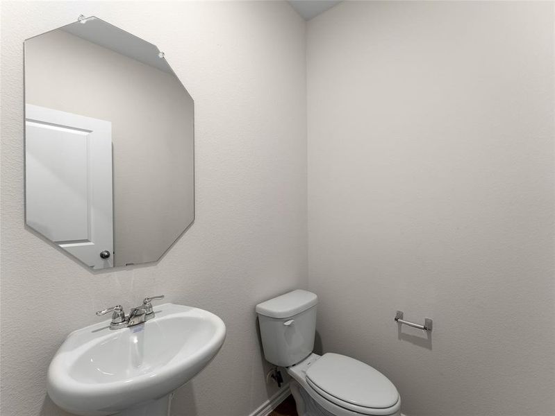 Bathroom with sink and toilet