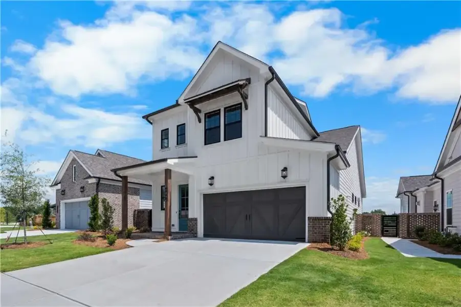 Front exterior of a new home in The Villas at Aberdeen, Hoschton, GA, highlighting curb appeal (Image 2). Front exterior of a new home in The Villas at Aberdeen, Hoschton, GA, highlighting curb appeal (Image 2).