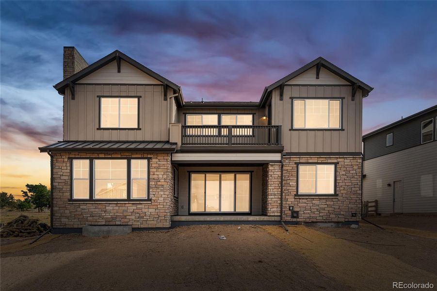 Front exterior of a new home in Sterling Ranch, Littleton, CO, highlighting curb appeal (Image 22).