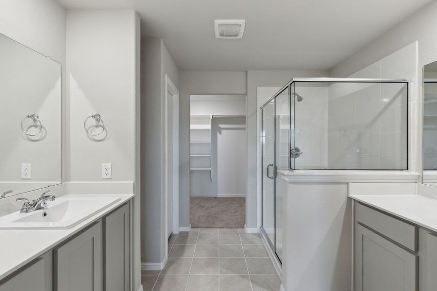 Primary Bathroom in the Harrison home plan by Trophy Signature Homes – REPRESENTATIVE PHOTO