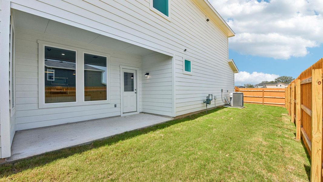 Exterior details and patio area of a home in Valverde, Bastrop (Image 2).