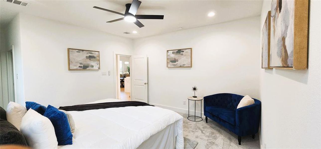Carpeted bedroom featuring ceiling fan and recessed lighting Carpeted bedroom featuring ceiling fan and recessed lighting