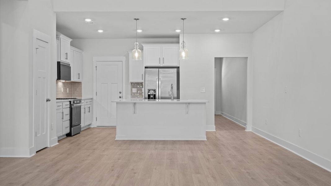 Notable two-story family room offering a grand yet inviting space for memorable everyday living Notable two-story family room offering a grand yet inviting space for memorable everyday living