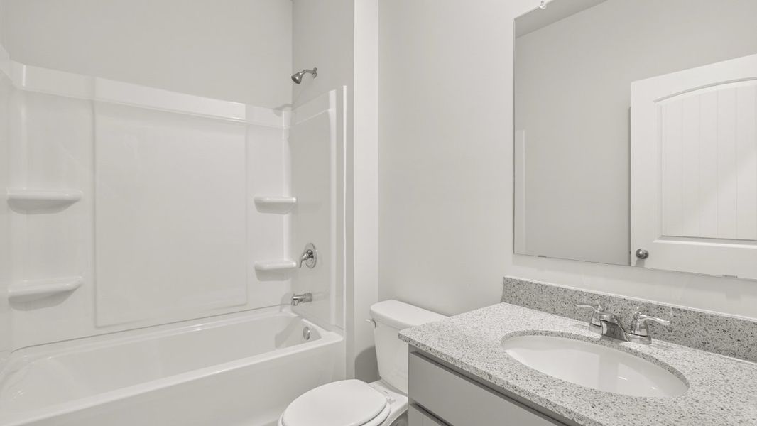 Representative furnished interior of a home built from the HALTON by D.R. Horton in Lost Creek, Dallas (Image 10).