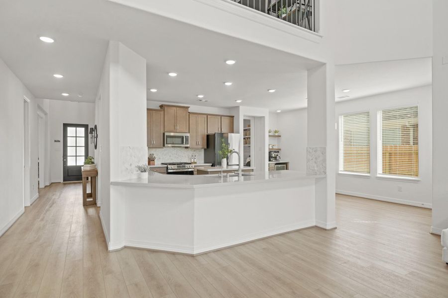 Bright, open-concept kitchen and living area with modern design and finishes.