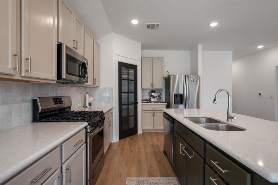 Furnished interior view inside a new home in Sun Chase, Del Valle (Image 11). Furnished interior view inside a new home in Sun Chase, Del Valle (Image 11).