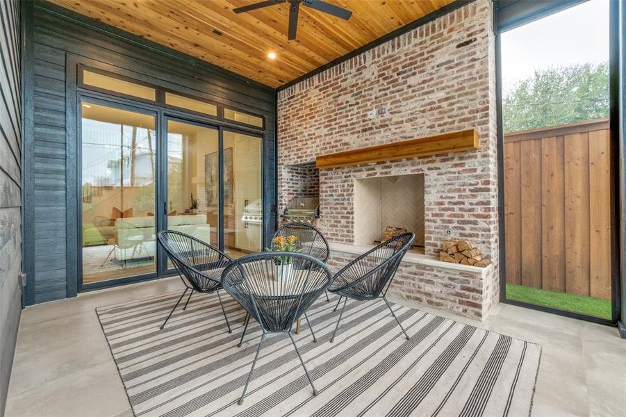 Sunroom / solarium featuring wooden ceiling and ceiling fan