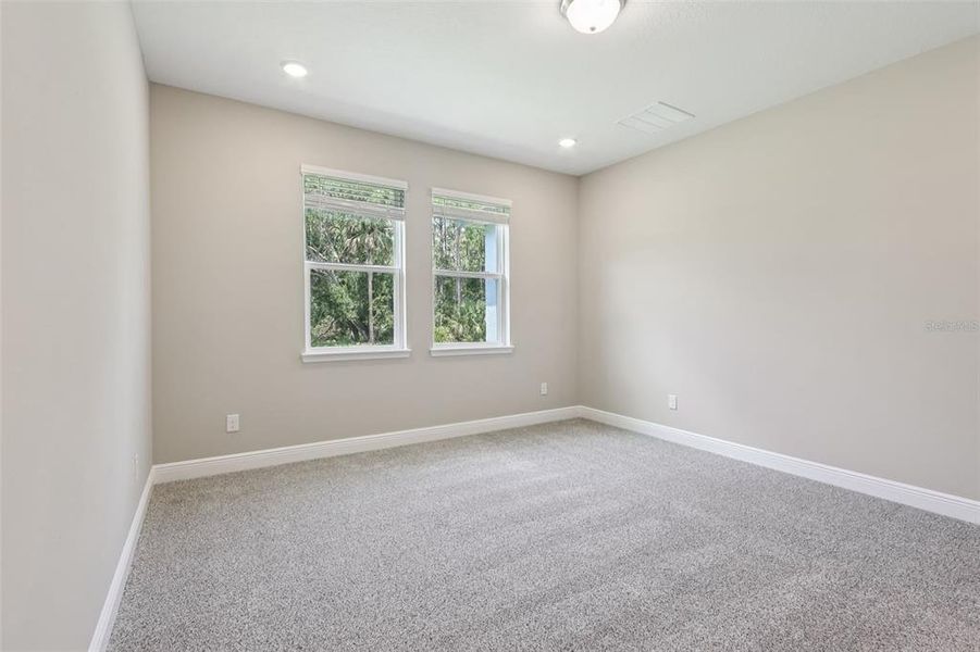 Spacious, unfurnished interior of a new home in Legends Preserve - Signature Series, Daytona Beach (Image 45).