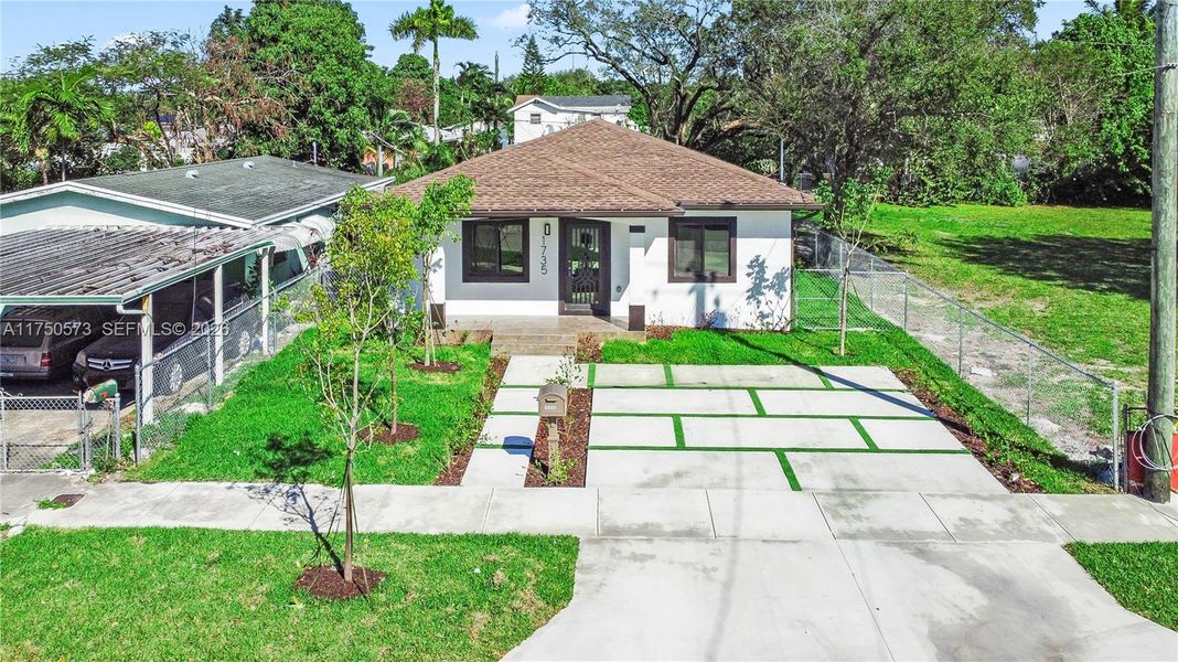 Front exterior of a new home in , Miami, FL, highlighting curb appeal (Image 1). Front exterior of a new home in , Miami, FL, highlighting curb appeal (Image 1).