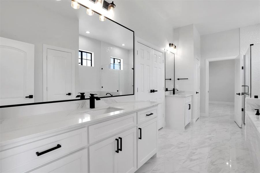 Bathroom featuring dual vanity and tile patterned floors