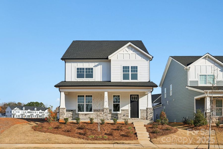 Front exterior of a new home in Edgewood Preserve, Huntersville, NC, highlighting curb appeal (Image 1).