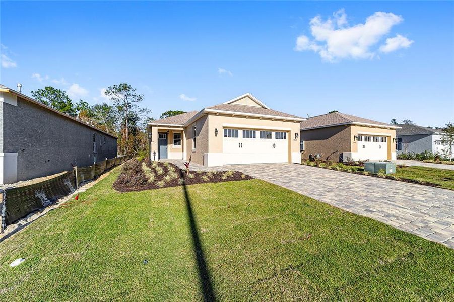 Front exterior of a new home in , Ocala, FL, highlighting curb appeal (Image 2). Front exterior of a new home in , Ocala, FL, highlighting curb appeal (Image 2).