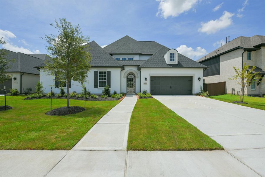 Front exterior of a new home in , Manvel, TX, highlighting curb appeal (Image 20). Front exterior of a new home in , Manvel, TX, highlighting curb appeal (Image 20).