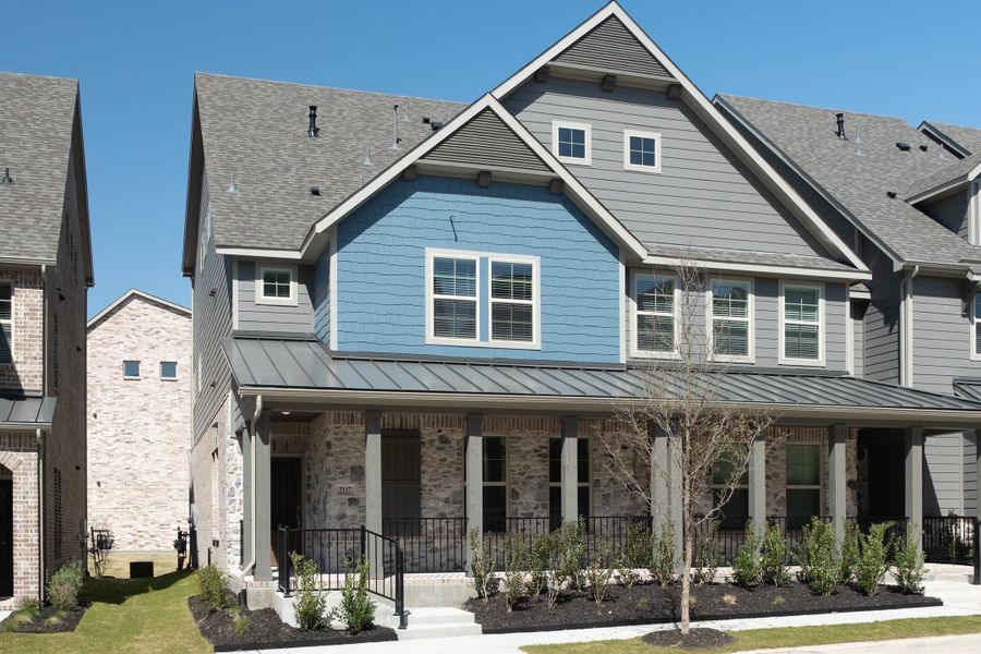 Front exterior of a new home in Bayside, Rowlett, TX, highlighting curb appeal (Image 1). Front exterior of a new home in Bayside, Rowlett, TX, highlighting curb appeal (Image 1).