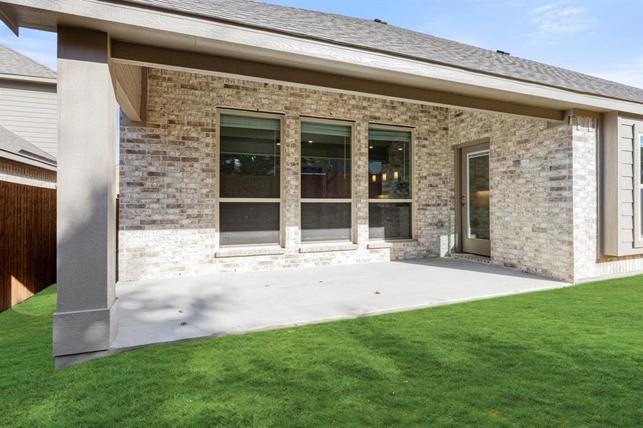 Exterior details and patio area of a home in The Enclave at Parks of Aledo, Aledo (Image 4).