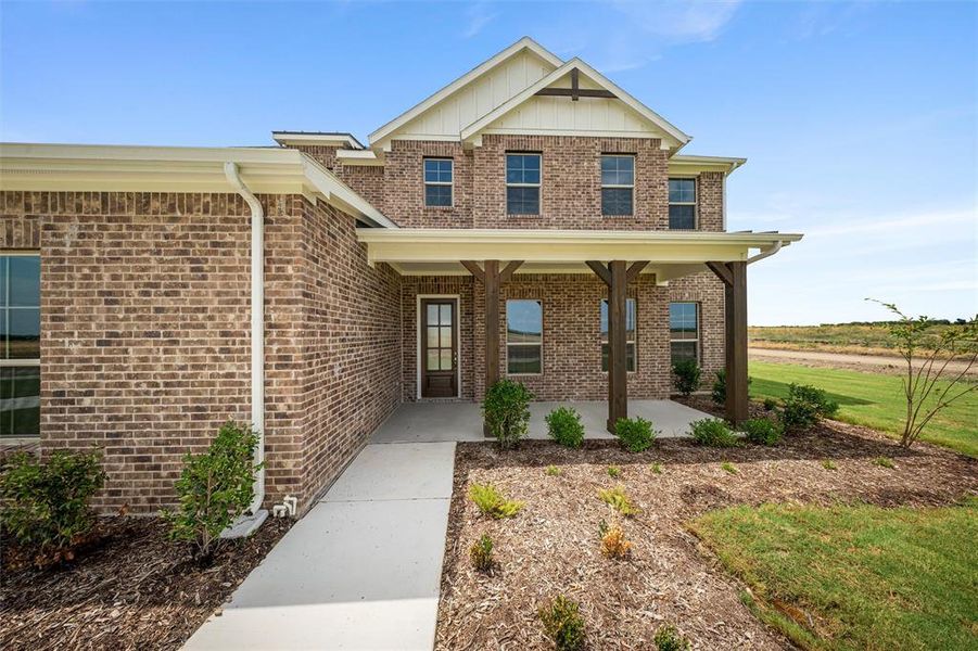 View of front of property with covered porch and brick siding View of front of property with covered porch and brick siding
