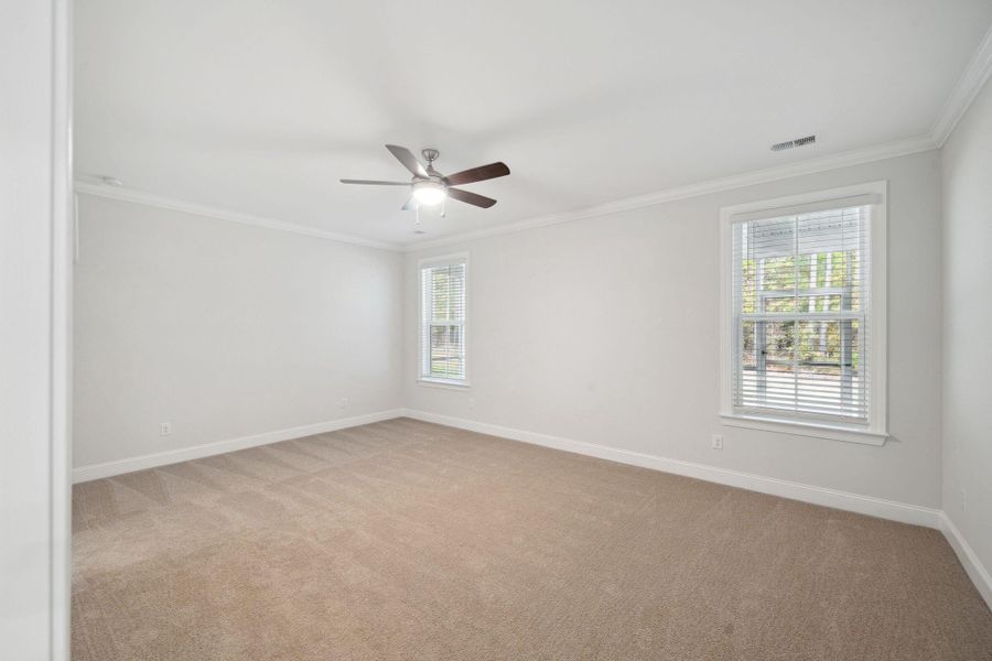 Spacious, unfurnished interior of a new home in Tidewater at Lakes of Cane Bay, Summerville (Image 29).