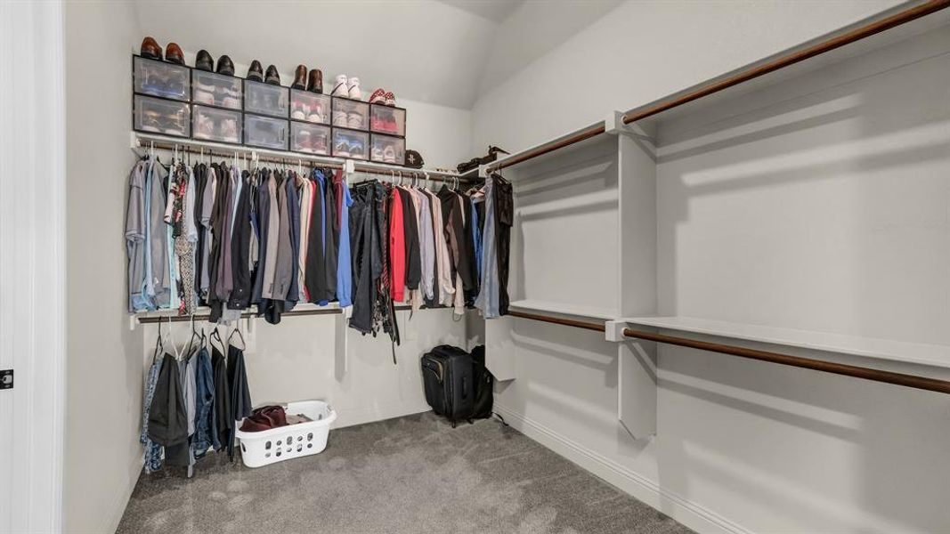 Primary bedroom closet provides ample storage space for your belongings.
