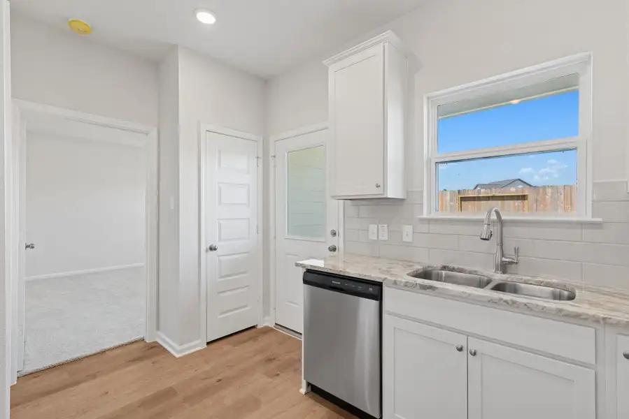 The Blue Jay II- Kitchen. Home under construction. Sample floor plan photo used for illustrative purposes only. Upgrades, selections options, windows and colors may vary. The Blue Jay II- Kitchen. Home under construction. Sample floor plan photo used for illustrative purposes only. Upgrades, selections options, windows and colors may vary.