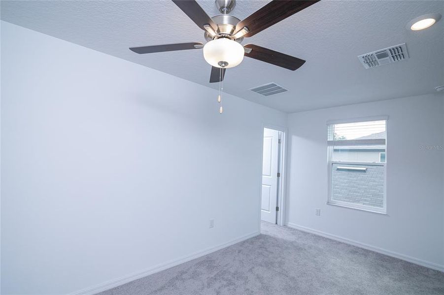 Spacious, unfurnished interior of a new home in Saddle Creek Preserve: The Manors II, Lakeland (Image 50).