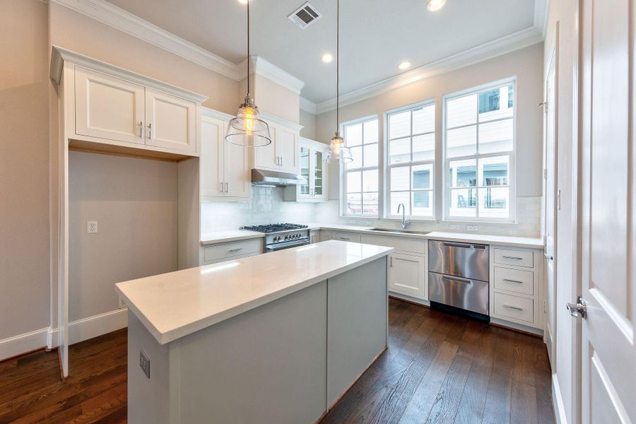 stunning kitchen with SS Bosch appliances and tons of natural light
