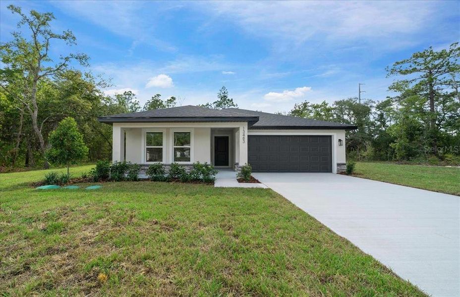 Front exterior of a new home in , Brooksville, FL, highlighting curb appeal (Image 27). Front exterior of a new home in , Brooksville, FL, highlighting curb appeal (Image 27).