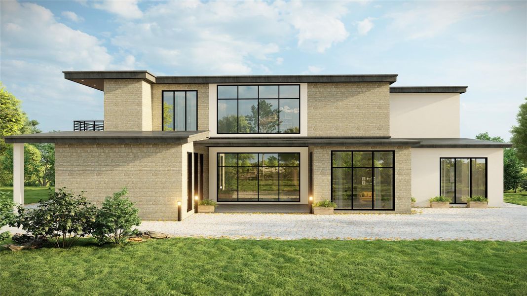 Rear view of property featuring brick siding and a lawn Rear view of property featuring brick siding and a lawn